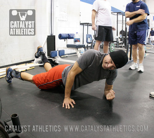 Derek Simonds enduring the productive pain of foam rolling - Olympic Weightlifting, strength, conditioning, fitness, nutrition - Catalyst Athletics 