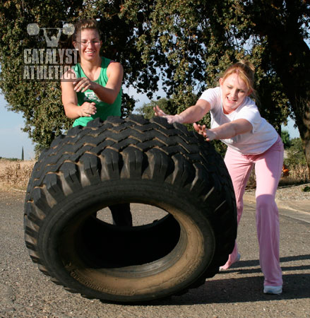 Team tire flipping. - Olympic Weightlifting, strength, conditioning, fitness, nutrition - Catalyst Athletics 